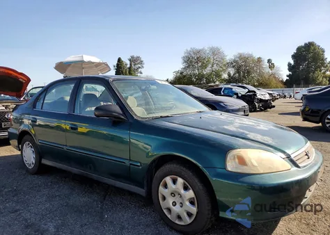 1999 Honda Civic Base z USA, uszkodzony, nr VIN 2HGEJ6614XH539542